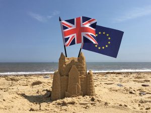 united kingdom and European Union flags on the beach