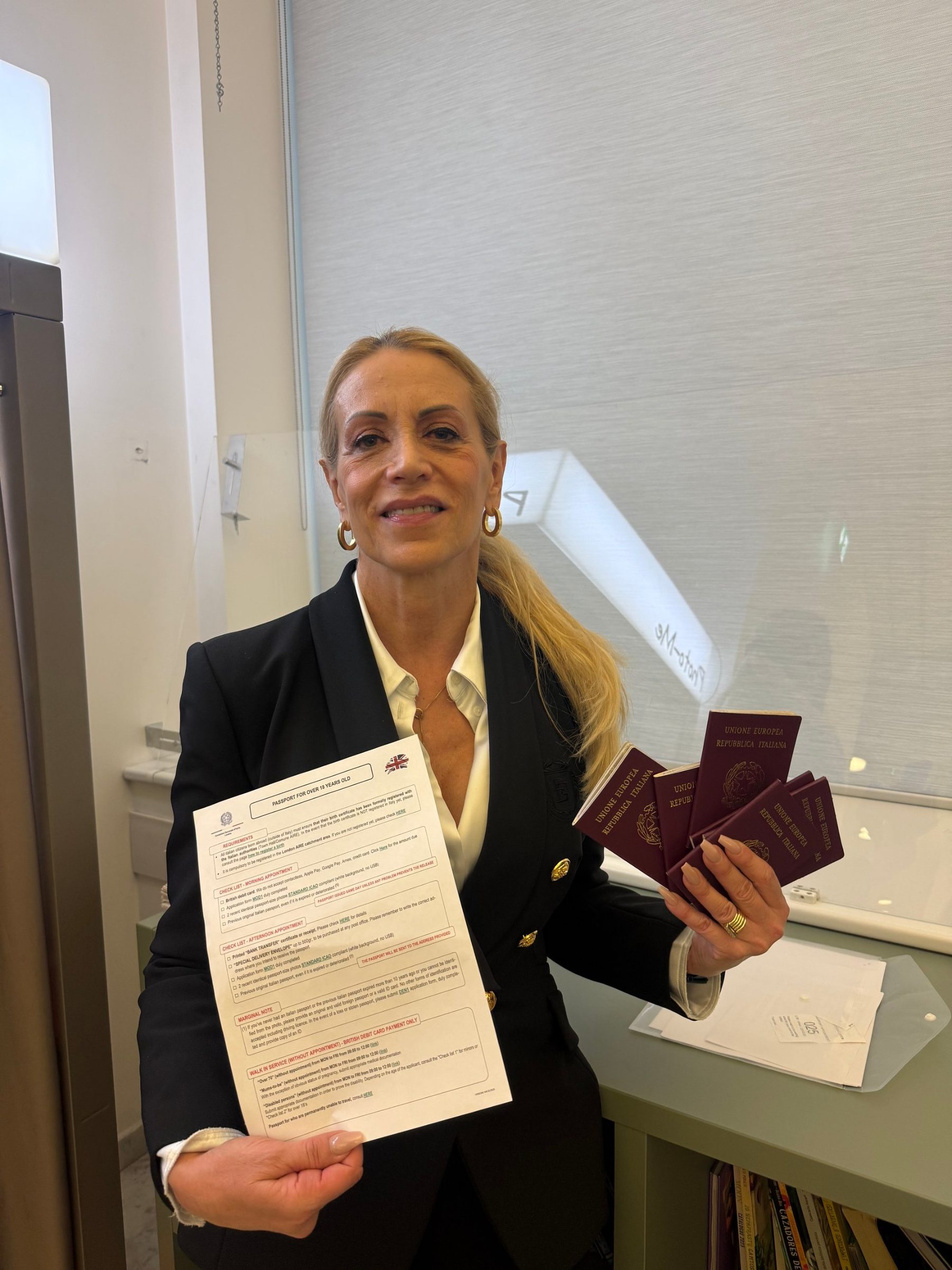 Michela de Julio with Italian passports at the Consulate General in London